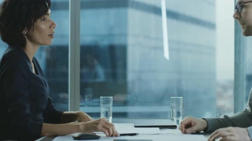 Businesswoman Shakes Hands After Meeting in Modern Office