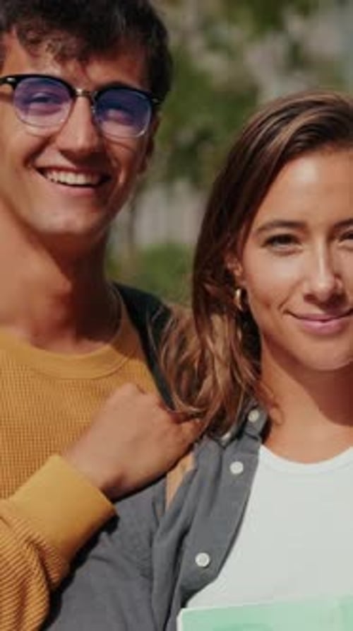 Close up of a group of mixed-sex students. Male and female young friends smiling at camera