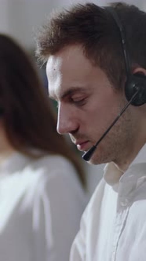 A Dedicated Customer Support Agent Working in a Modern Office Ensuring Excellent Assistance