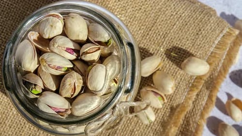 Pistachios in Jar with Burlap Close Up