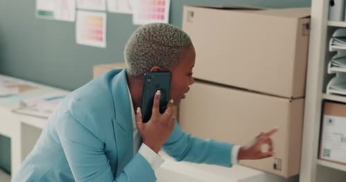 Woman talking on smartphone in office environment