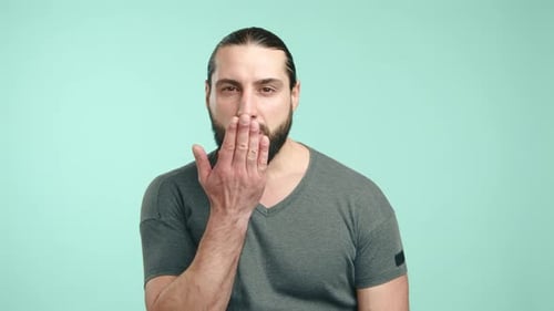 Bearded Man Sending an Air Kiss to the Camera