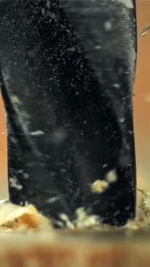 The Master Drills the Board Macro Shooting Filmed on a Highspeed Camera at 1000 Fps