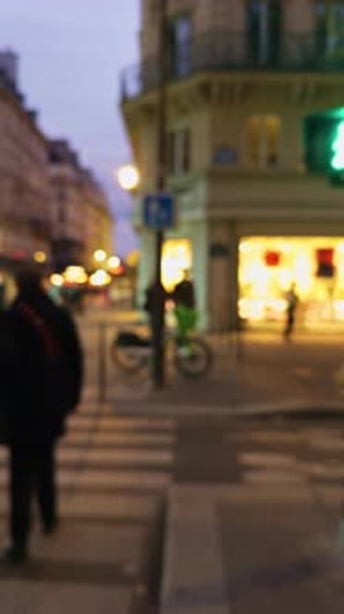 A Charming Urban Street Crossing Scene Captured at Dusk Within a Modern City Filled with Activity