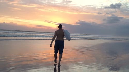 Young Man Walking on Beach During Sunset, Super 240