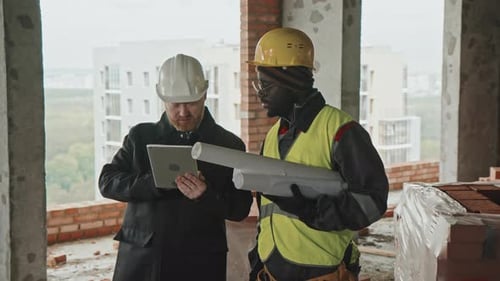 Engineer And Foreman Discussing Work Plan
