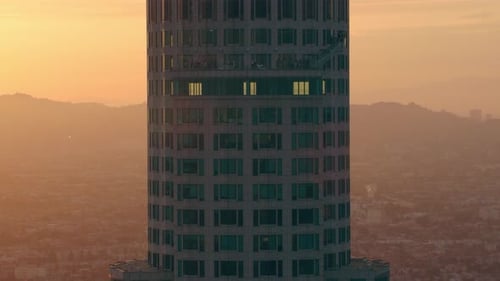 Soaring above downtown Los Angeles California at sunset near 777 tower