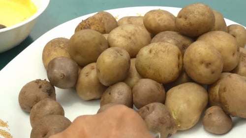 Brown Potatoes on Plate Close Up