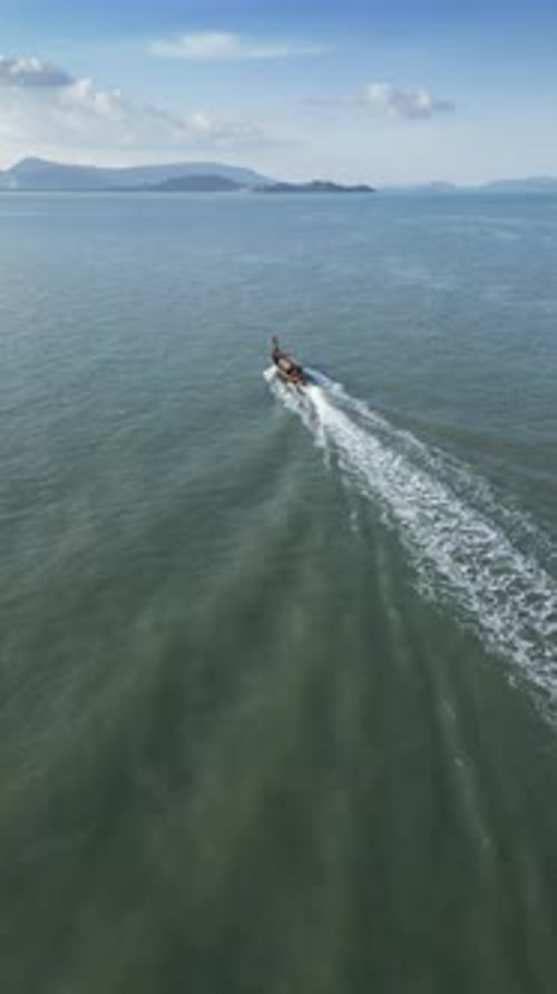 Vertical Video Aerial View of Boats in a Peaceful Harbor in Thailand Blue Waters