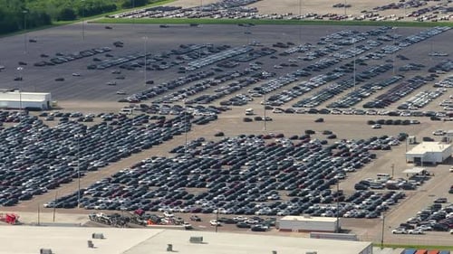New Cars Parked for Sale on Automotive Factory Parking Lot Dealer Vehicle Inventory for Import and