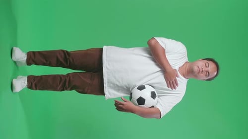 Full Body Of Asian Man With A Ball Putting Hand On His Heart To Respect On Green Screen