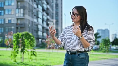 Middle Aged Woman Talking on Video Call Using Smartphone Urban Outdoor City