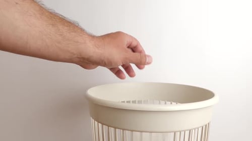 Discarding Face Mask and Safety Glasses in Bin