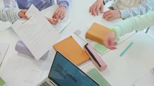 Students Collaborate on Sixth Grade Math Assignment in Classroom