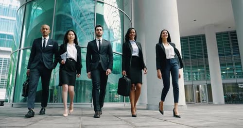 Team of Colleagues Walking Confidently to Work