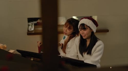Young Women Singing at Piano During Christmas
