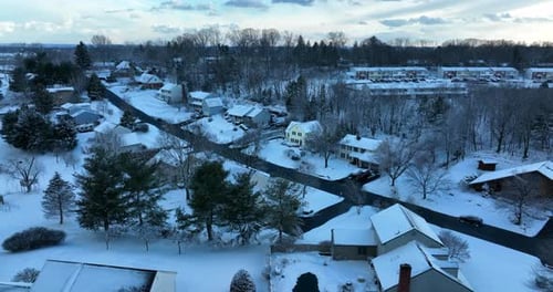 Residential housing community in winter snow. Population in USA. Aerial view of residential housing