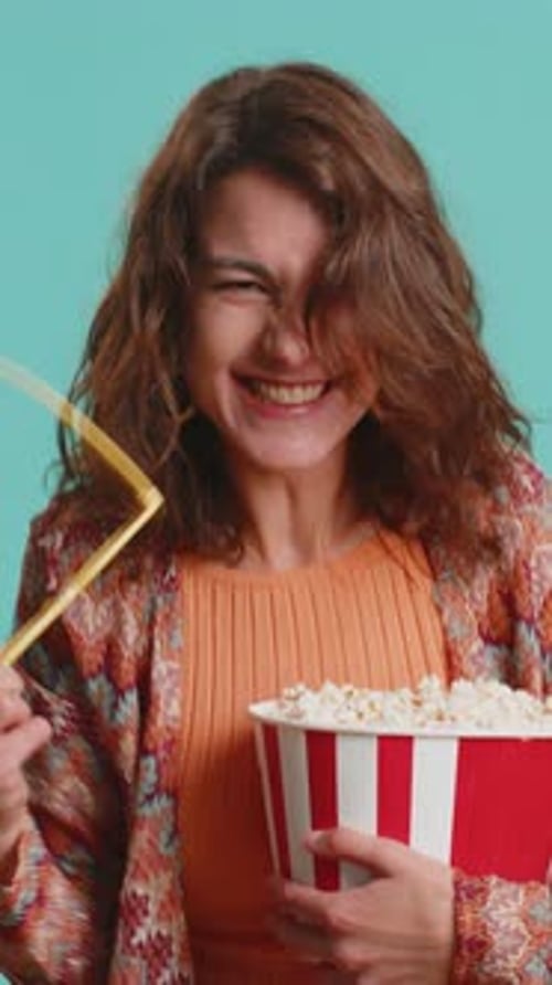 Excited Woman with Popcorn and 3D Glasses