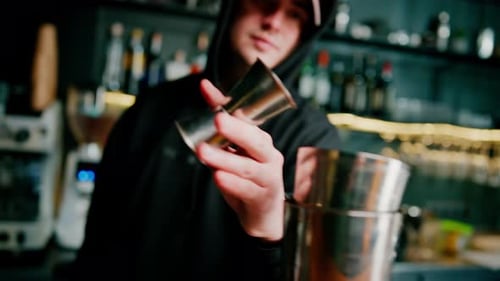 Bartender preparing a cocktail in a bar