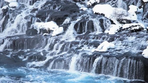 Snowy Waterfall with Pure Blue Glacier Water in Iceland Frozen Winter Landscape Magical Outdoor