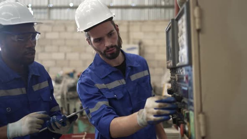 Technicians Inspecting Machine in Factory Wearing Hard Hats, Industrial ...