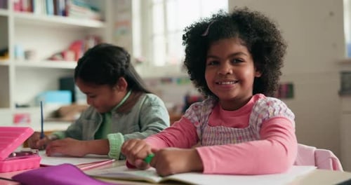 Girls Studying and Smiling in School Classroom