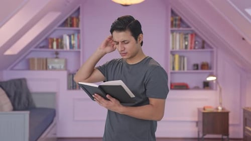 Man Reading a Book, Confused, Indoors