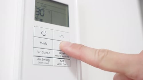 Lowering Temperature on Digital Thermostat Indoors