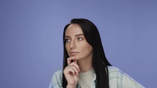 Pensive Woman with Finger on Chin