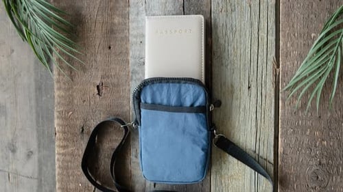 Travel Bag and Passports on Rustic Wood Surface