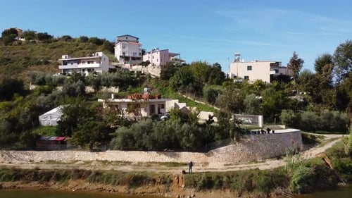Aerial above albanian coastal village, Golem. Scenic landscape in urban area.