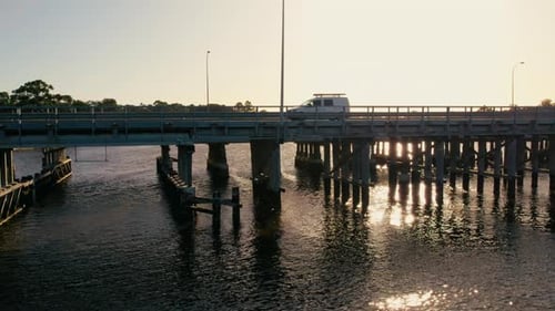 Sunset View Over a Tranquil River Bridge