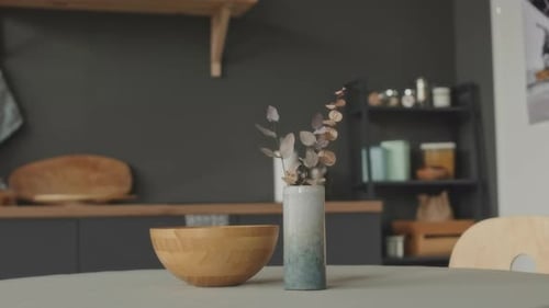 Simple Kitchen Interior with Wooden Bowl and Vase