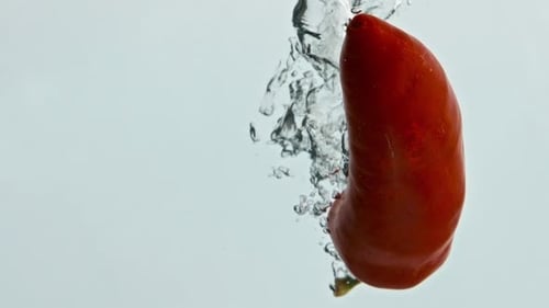 Chili Pepper Sinking into Water Creates Bubbles