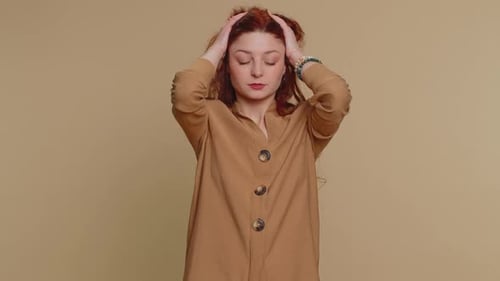 Young Woman Suffering from Headache, Rubbing Temples