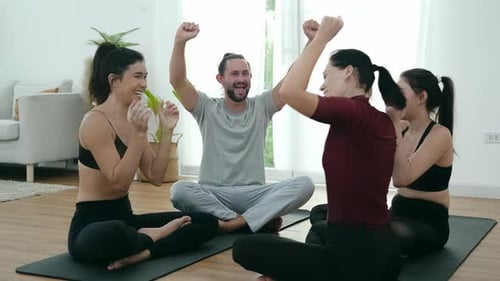 Group yoga session promotes mindfulness and connection in bright studio space