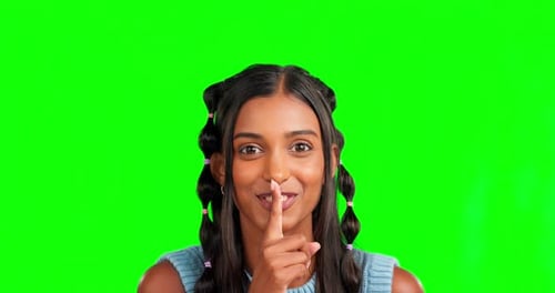 Green screen, face and happy woman with finger on lips, background and privacy secret