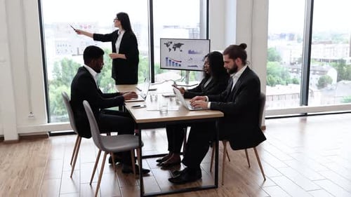 Business Presentation in Modern Office with Professional Team