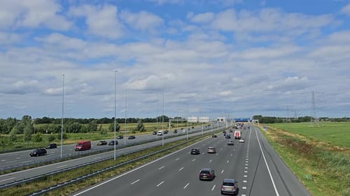 Cars moving fast on a busy highway