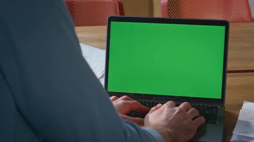 Unrecognizable Businessman Working Chroma Key Laptop in Modern Workplace Closeup