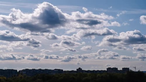 Timelapse Storm Clouds Moves Over The Silhouettes of High Rise Buildings Roofs