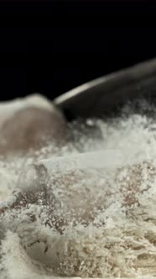 The Rolling Pin Falls Into the Flour Filmed on a Highspeed Camera at 1000 Fps