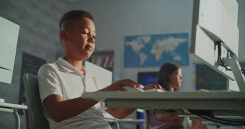 Young Students Learning and Using Computers in Classroom
