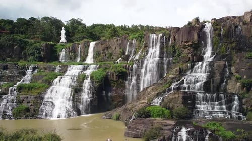 Aerial View of Picturesque Tropical Waterfalls Cascade in Asia with Lady Buddha