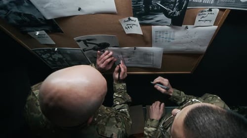 High Angle of Commanders Briefing Military Strategy in Hub