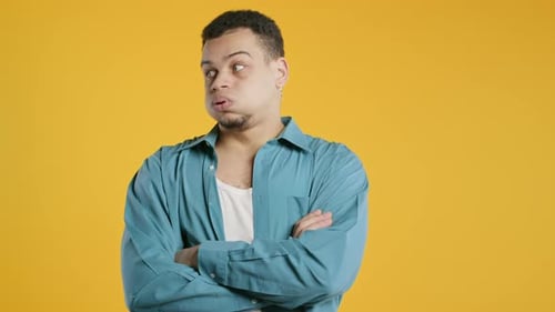 Man Rolling Eyes and Looking Bored on Yellow