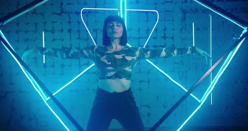 Woman Breathes Deeply and Stands in Yoga Pose Joining Hands