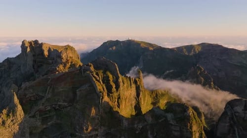 Stunning aerial views of rugged mountain landscape at sunrise