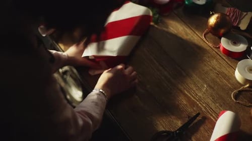 Wrapping Christmas Gift with Red and White Paper