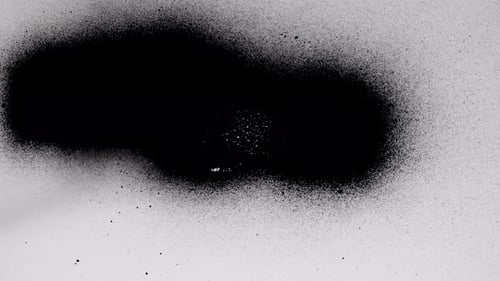 Spreading Black Ink Blot on White Background